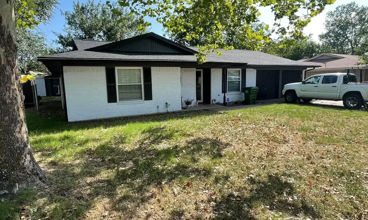 Professional roofing crew working on a residential roof in Union City